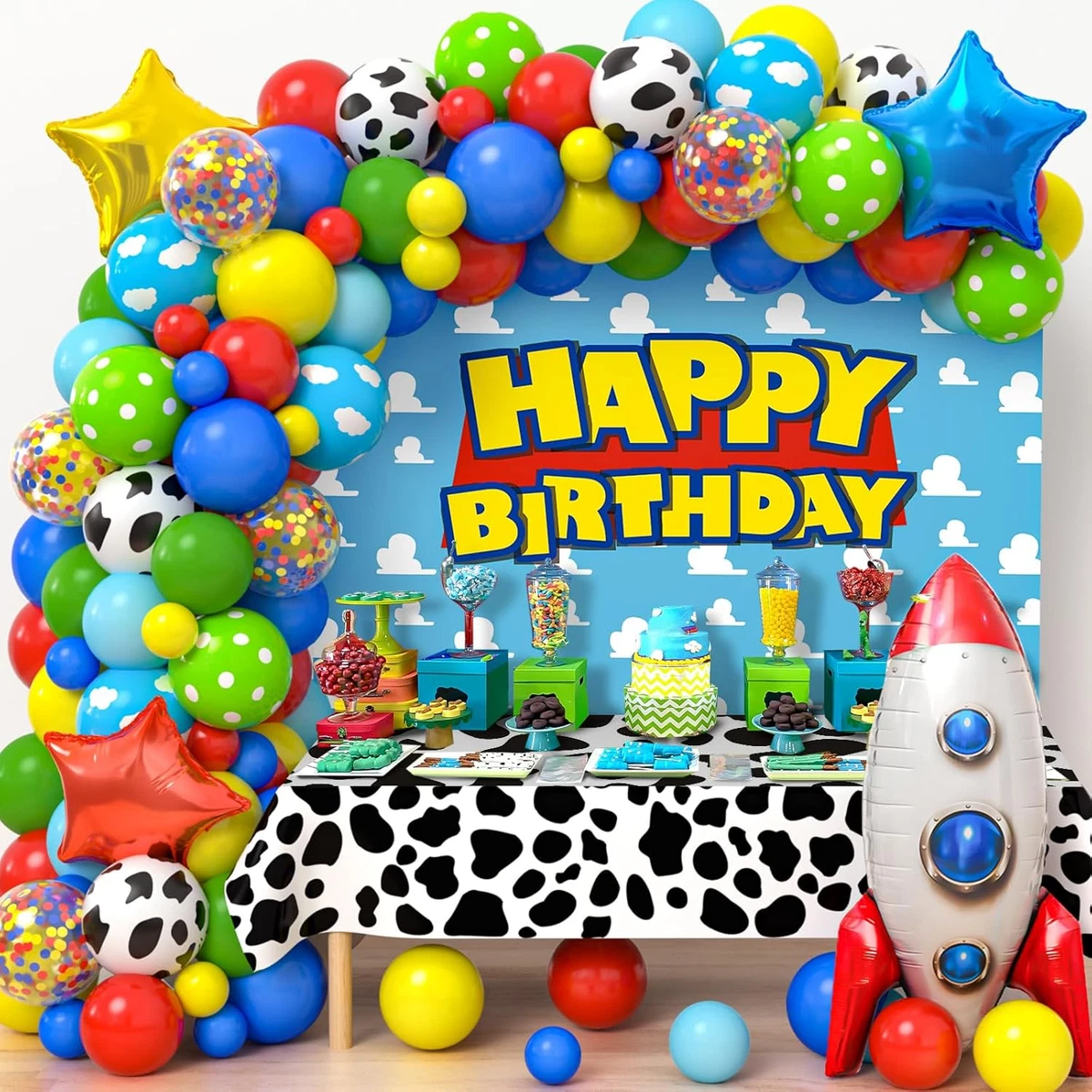 Decoración de cumpleaños con globos, mantel animal print y globo cohete